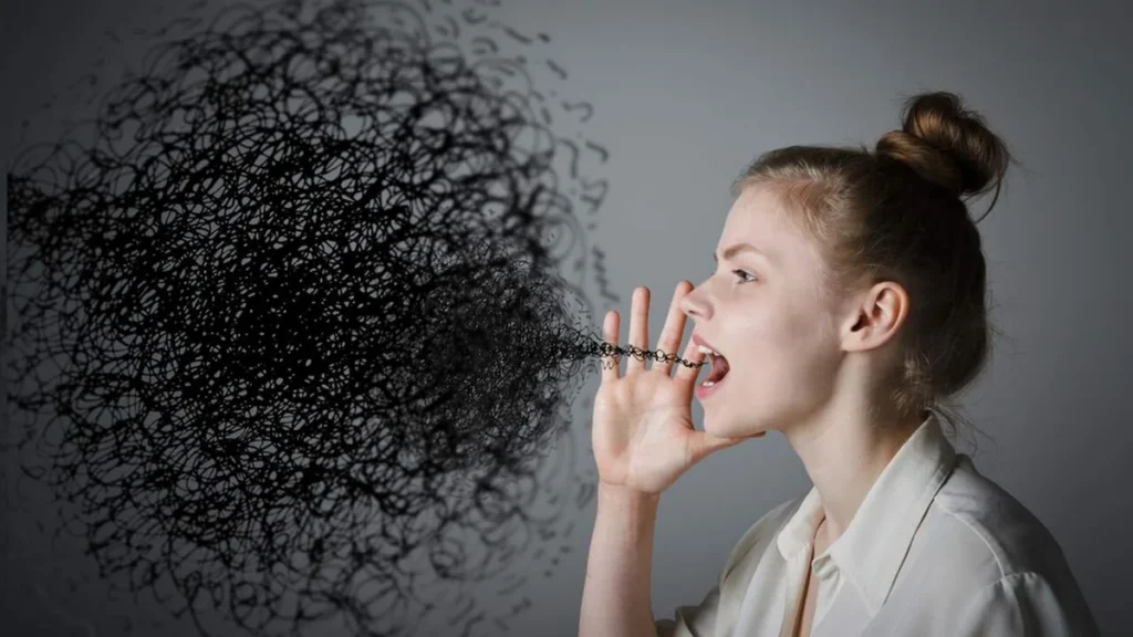 Imagem Pessoa falando coisas ruins mulher com mao na boca e saindo coisas ruins de sua boca do artigo O que devo fazer quando alguém vem me falar de outra pessoa?