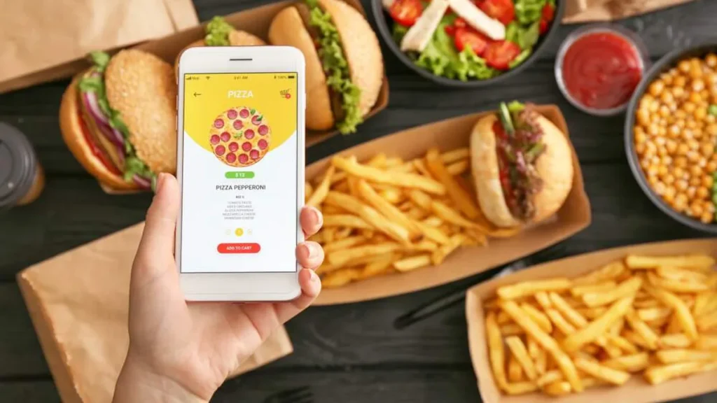 Imagem delivery de comida fast food junk food do artigo 5 motivos para você cuidar da sua alimentação