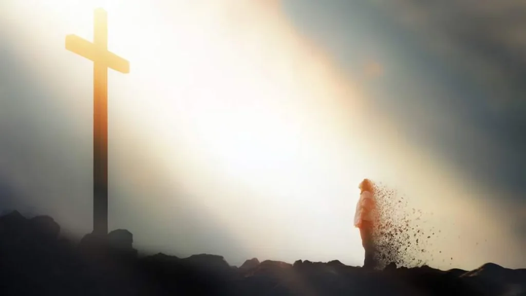 Imagem cruz e um homem voltando o seu olhar para ela do artigo Dogmas da Igreja: O homem caído não pode redimir-se a si próprio